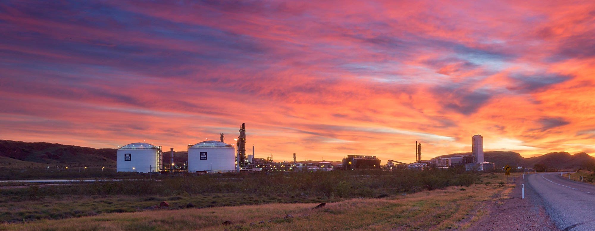 Picture of two tanks against pink, blue and orange sunset