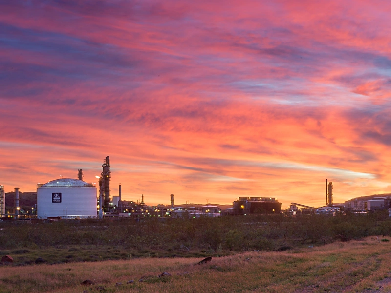 Picture of two tanks against pink, blue and orange sunset