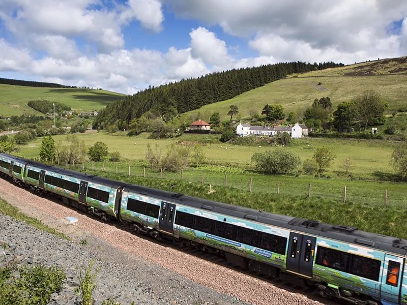 Passanger train passing through british countryside