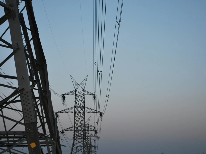 High voltage electricity tower landscape at sunset