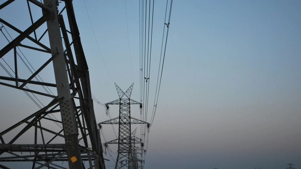 High voltage electricity tower landscape at sunset