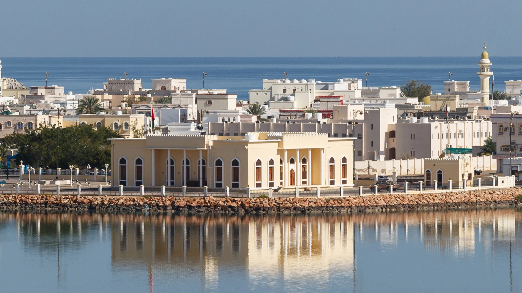 Across the water shot of Oman Refineries and Petro Chemicals (ORPIC) against a blue sky