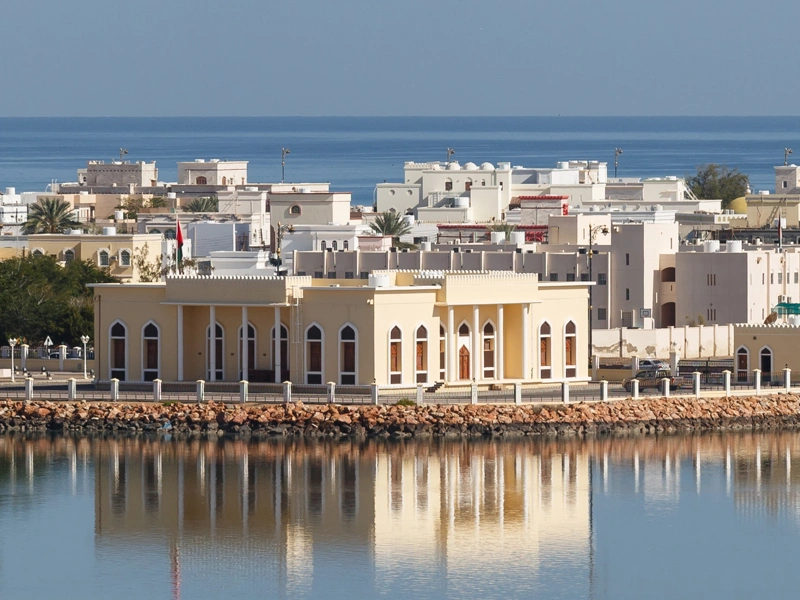 Across the water shot of Oman Refineries and Petro Chemicals (ORPIC) against a blue sky