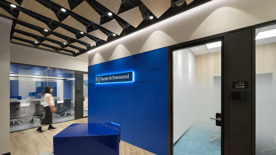 Turner & Townsend Taiwan office reception, with blue background and logo.