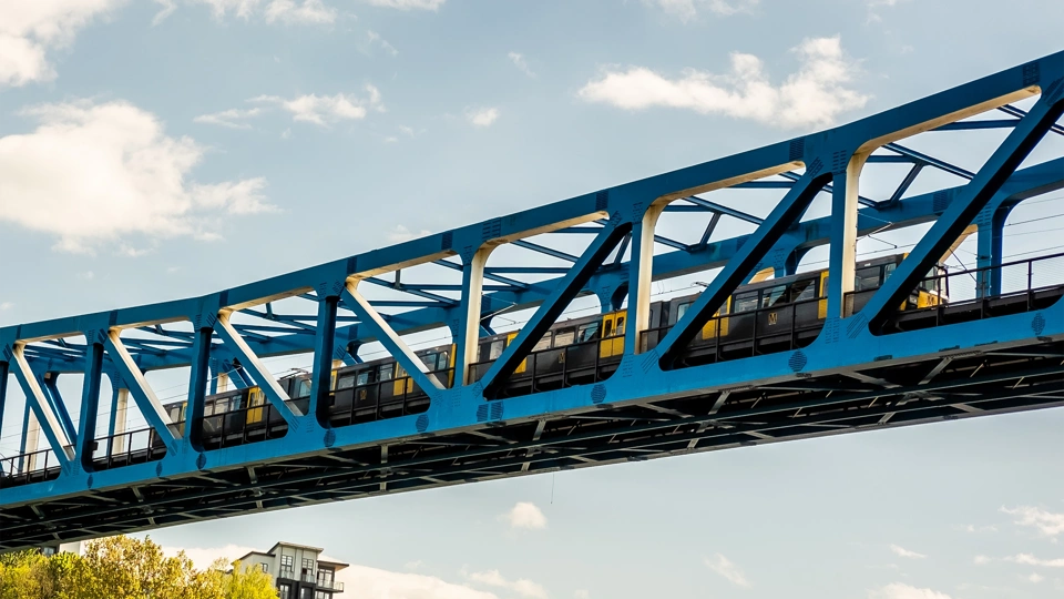 Image of railway bridge with train passing by