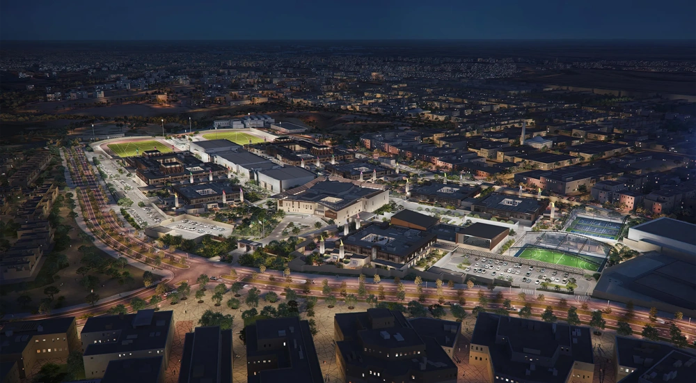 Aerial rendering of Misk Schools teaching and sport facilities at night, Riyadh, Saudi Arabia