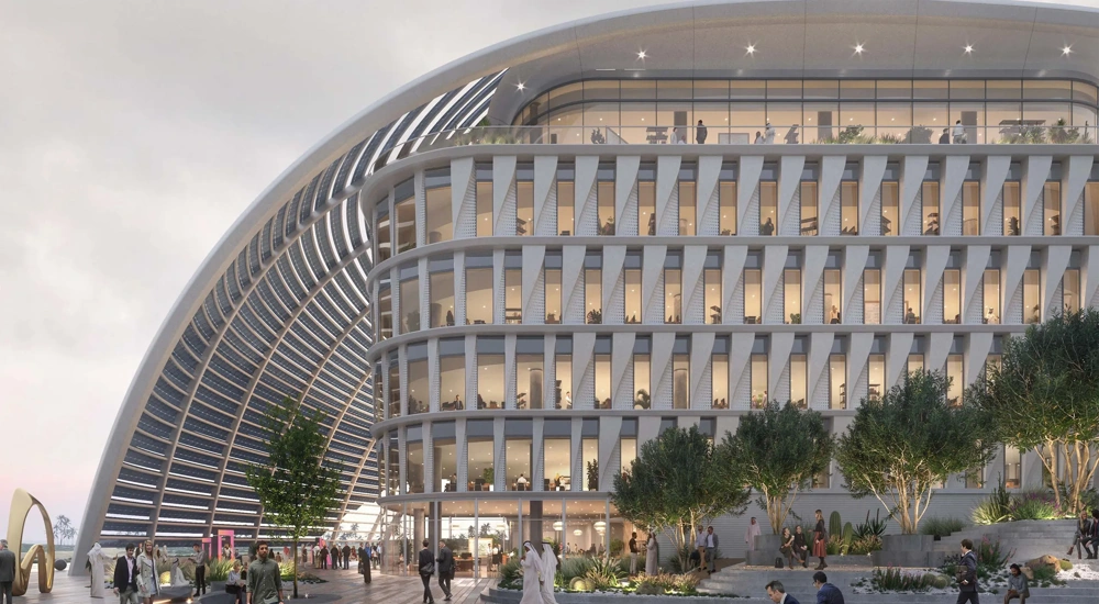 A futuristic, white multi-story office campus building.