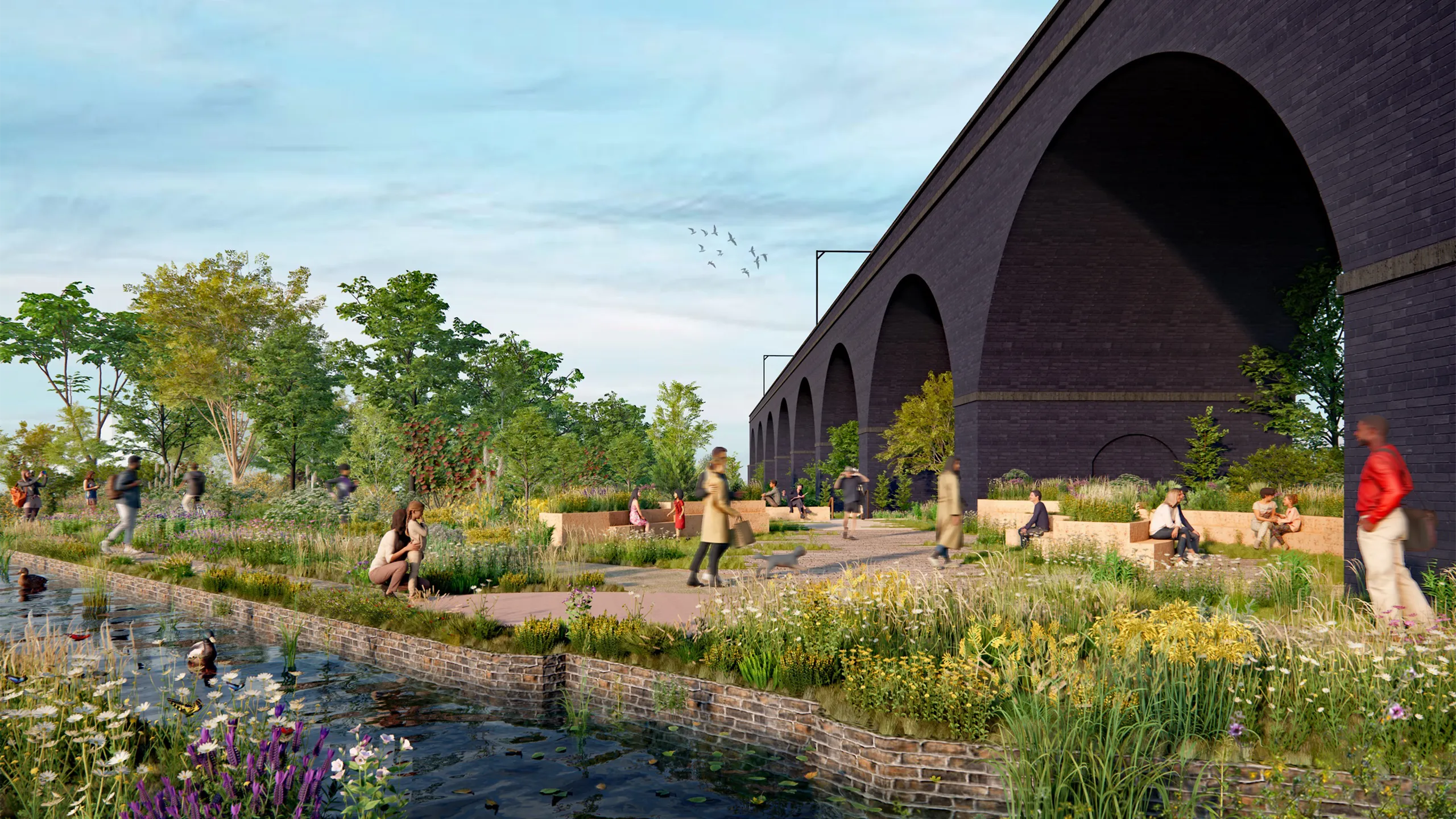 image of SMG canal with green grass and plants and people walking past.