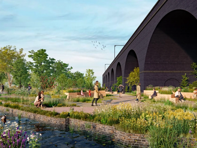 image of SMG canal with green grass and plants and people walking past.