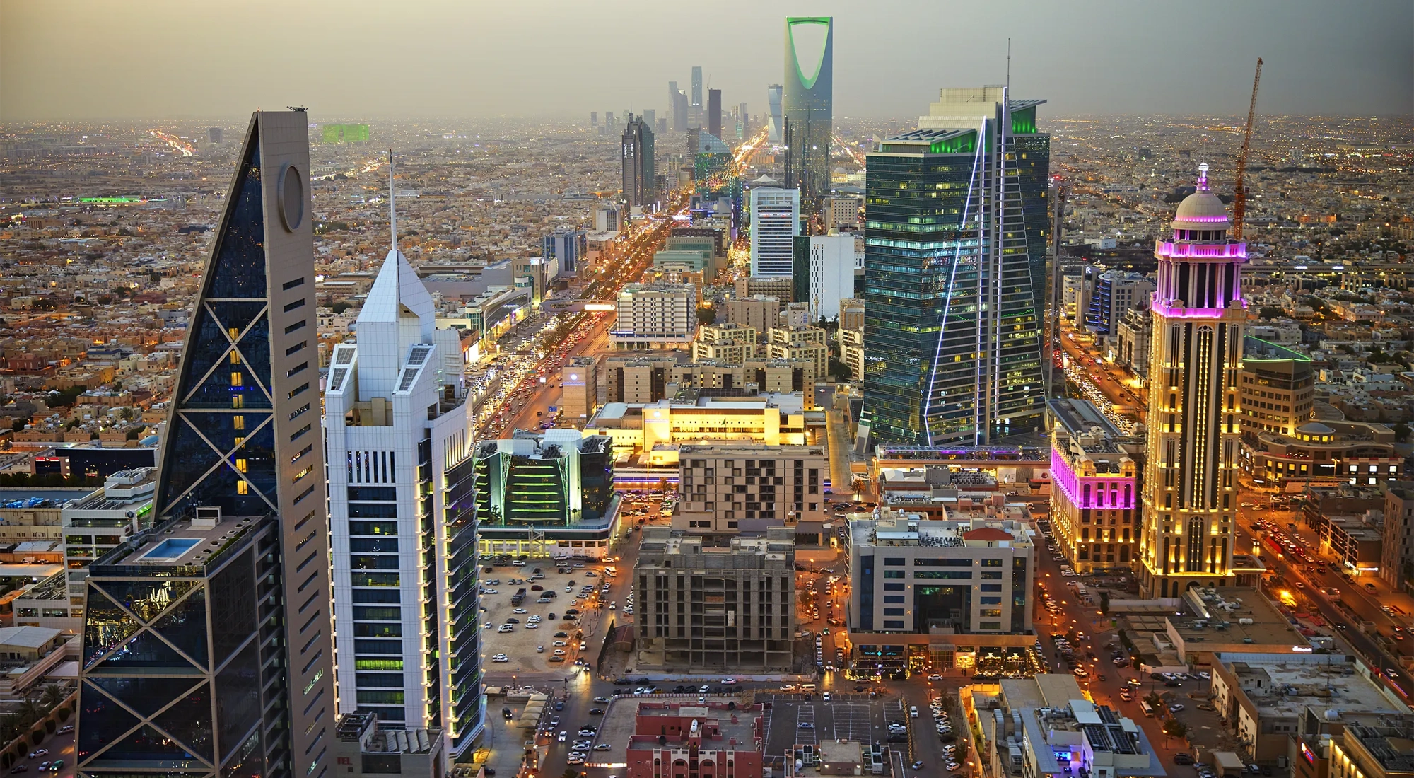 High angle view of central business, finance, and residential districts at dusk