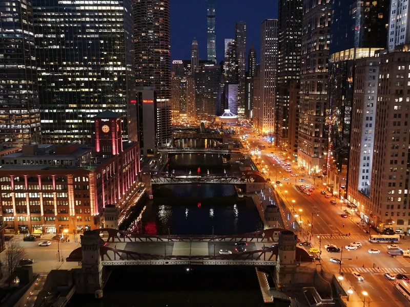 Night Chicago Skyline At Chicago In Illinois United States. Illuminated Downtown. City At Night Landscape. Chicago At Illinois United States. Chicago City District. City Skyline Scene.
