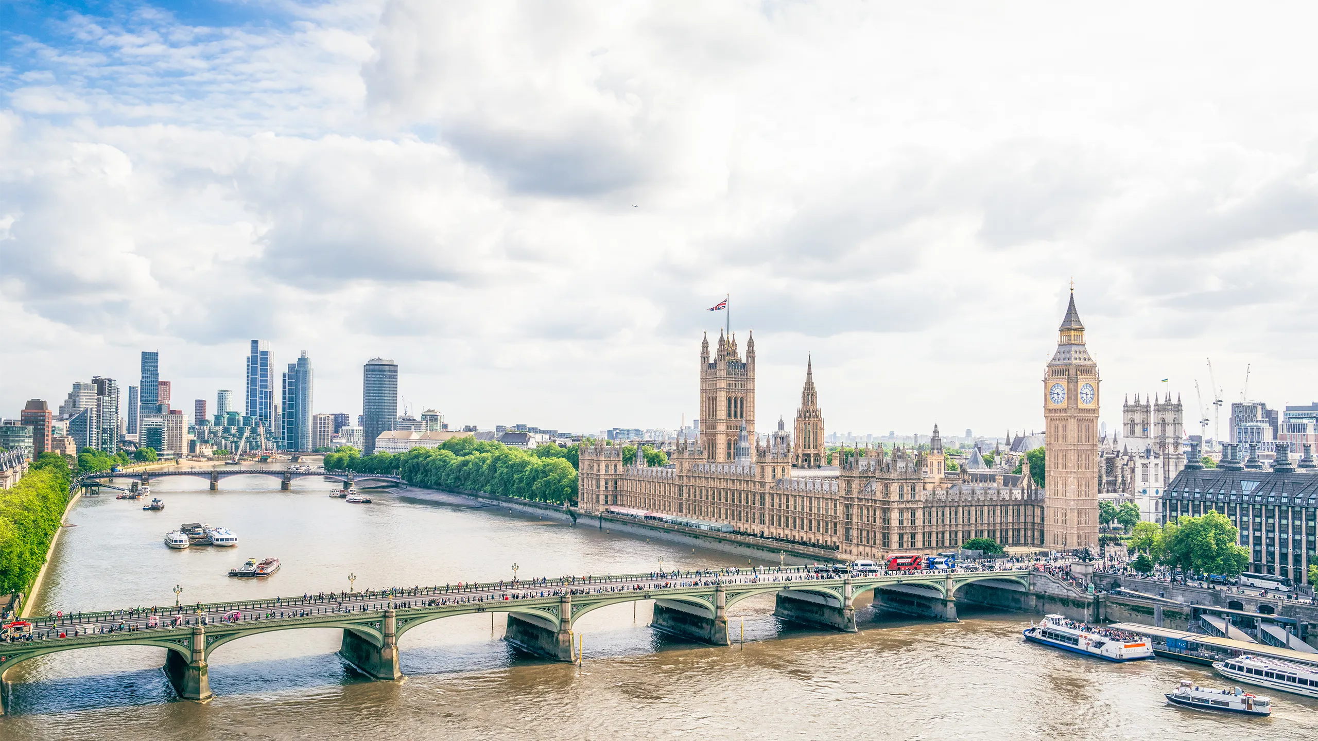 A high angle view of Westminster in central London, with Westminster Bridge across the Thames, leading to Big Ben and the Houses of Parliament.