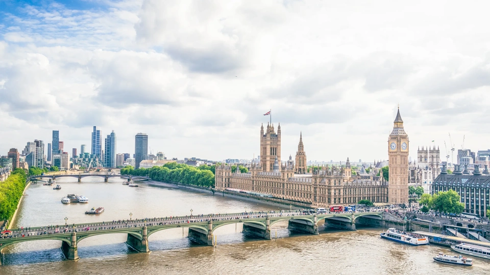 A high angle view of Westminster in central London, with Westminster Bridge across the Thames, leading to Big Ben and the Houses of Parliament.