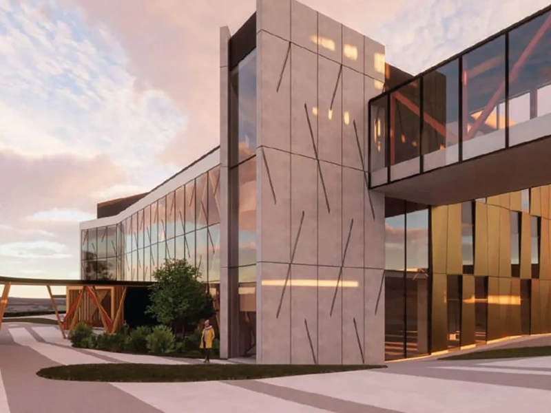 Modern hospital exterior with glass facade at dusk.