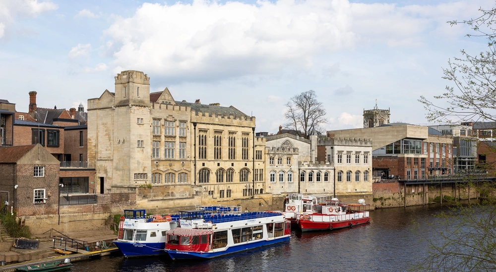 External shot of The Guildhall and the adjacent River Ouse in the UK