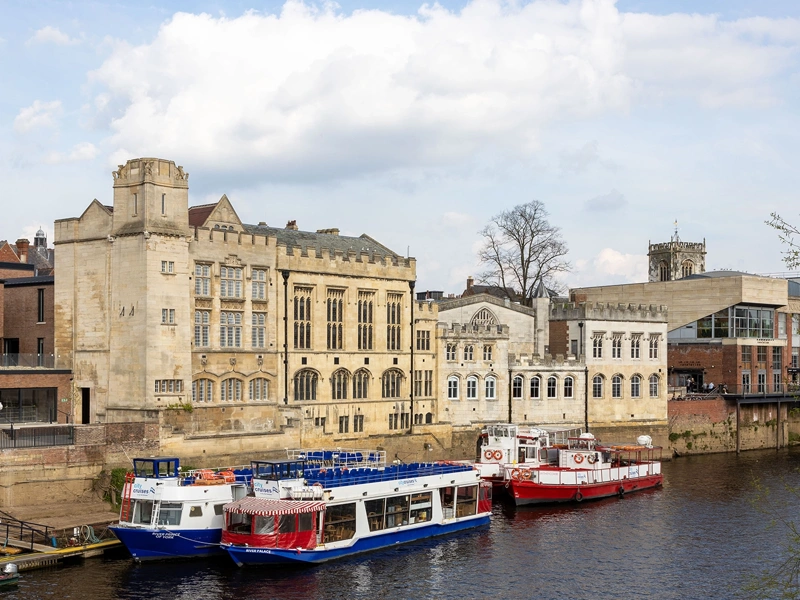 External shot of The Guildhall and the adjacent River Ouse in the UK