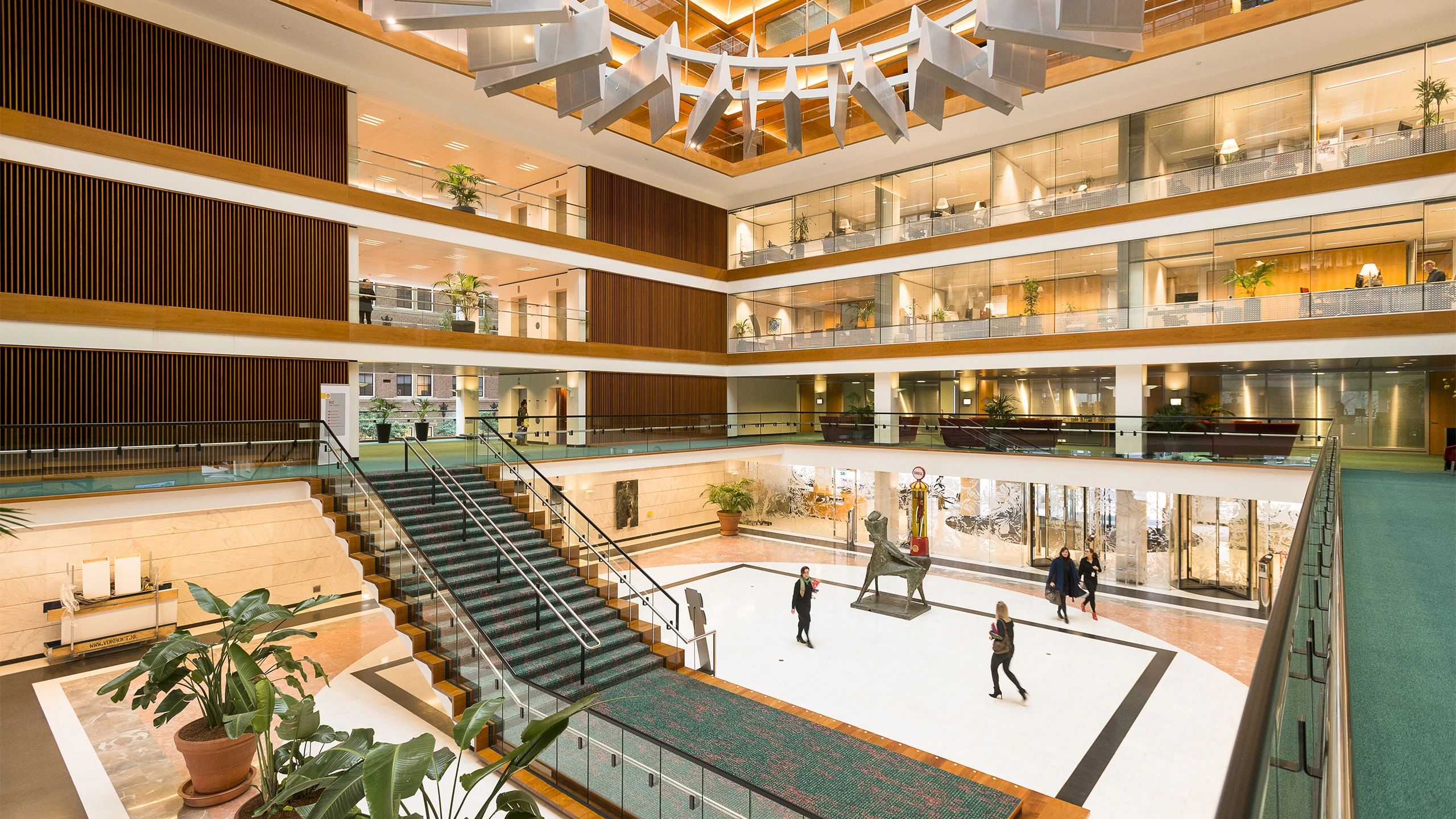 Shell's offices in The Hague, The Netherlands, a modern, open-plan atrium with large staircase
