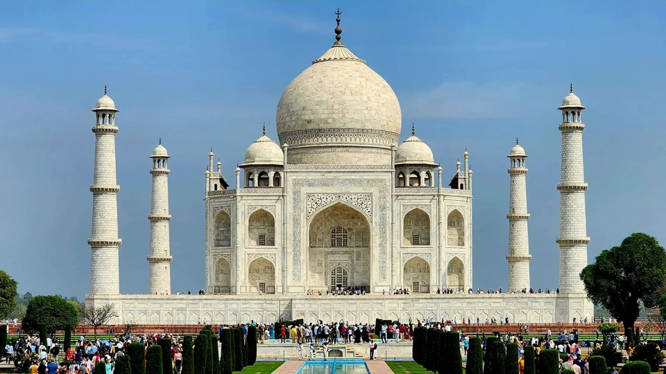 View of the Taj Mahal on a busy sunny day