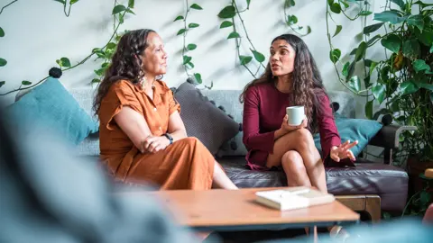 Two Aboriginal women in a meeting room