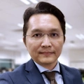 Portrait of Leo Leow, Country Director, Malaysia, in a modern office