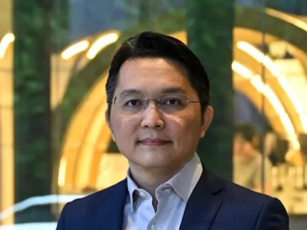 Portrait of Leo Leow, Country Director, Malaysia, in a modern office