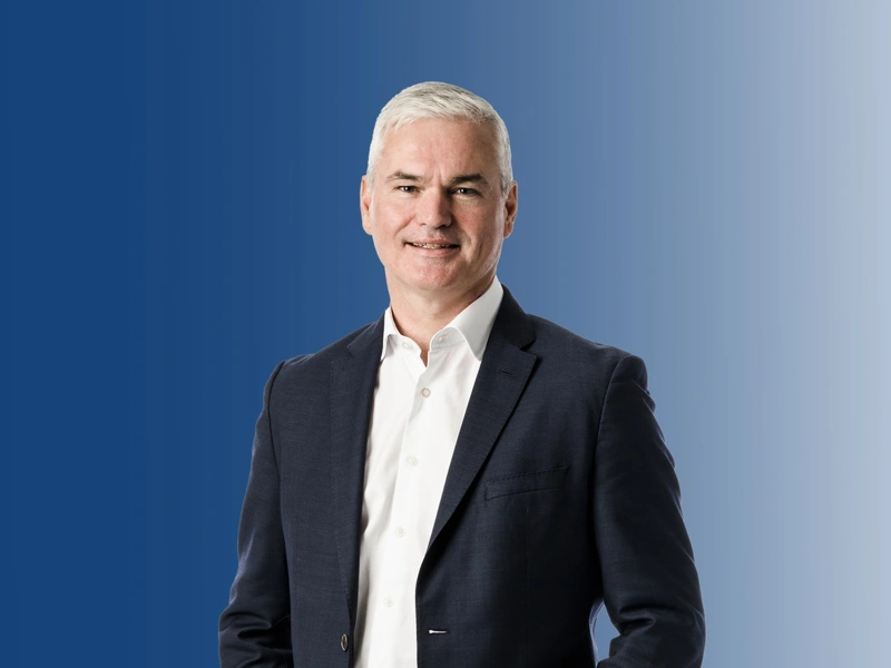 Image of Vincent Clancy standing and smiling.