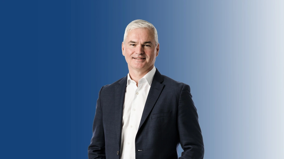Image of Vincent Clancy standing and smiling.