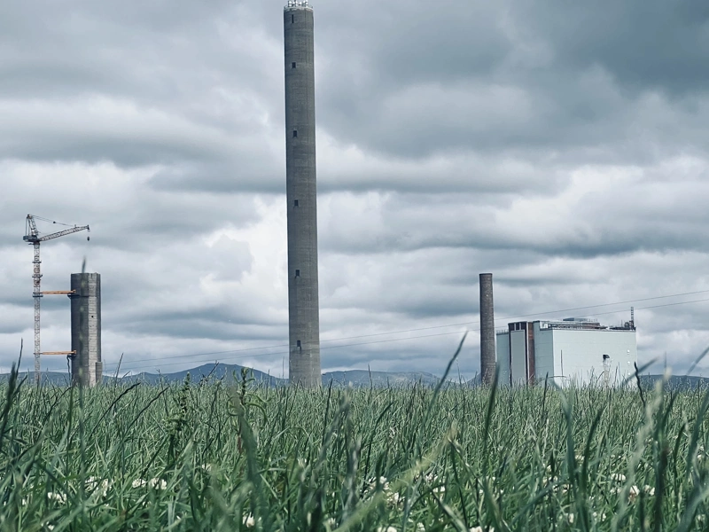 Factory in a landscape with green grass