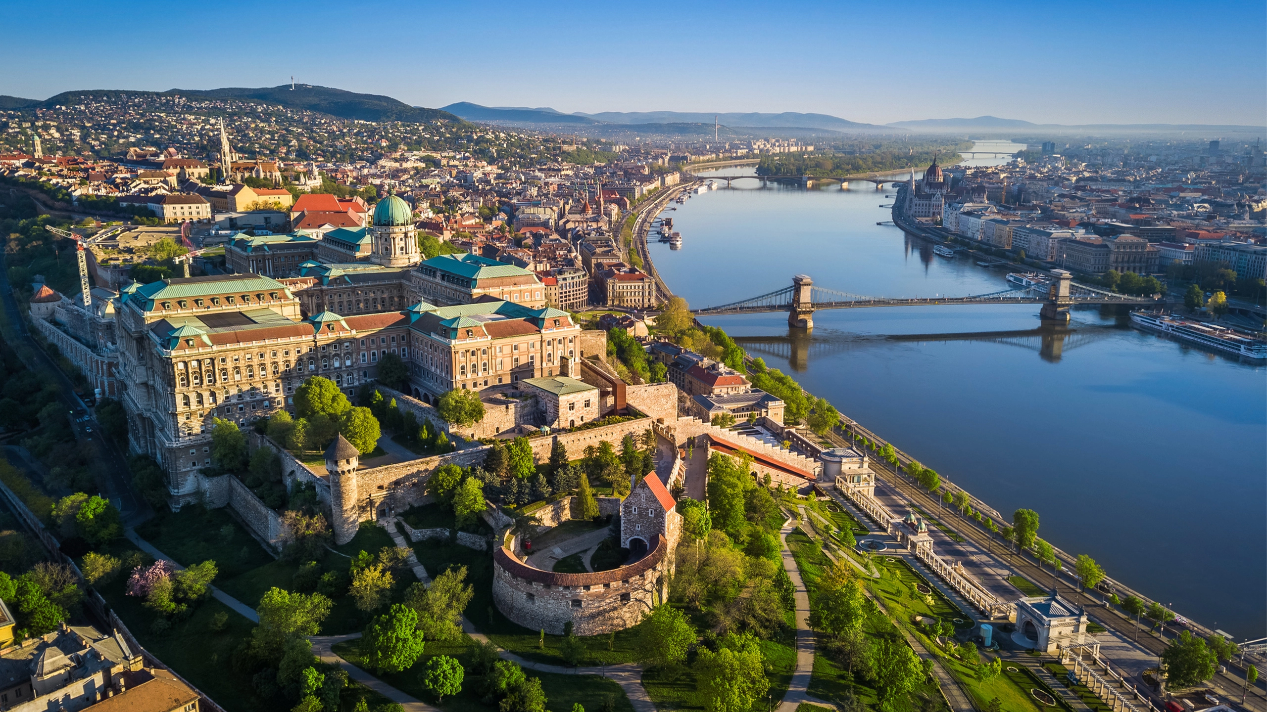 Beautiful aerial skyline view of Budapest at sunrise with Szechenyi Chain Bridge over River Danube, Matthias Church and Parliament