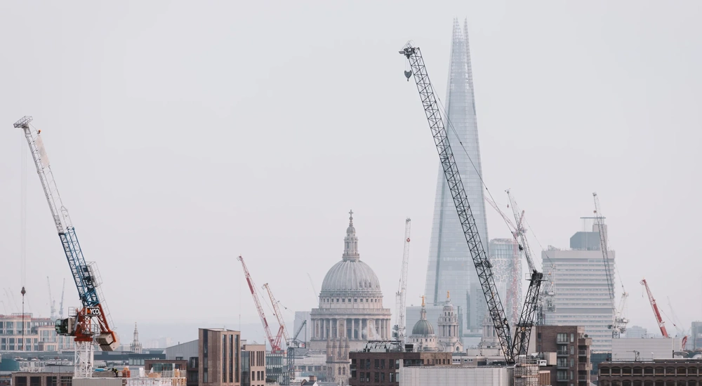 London cityscape skyline with iconic landmark buildings in The City with dramatic stormy sky