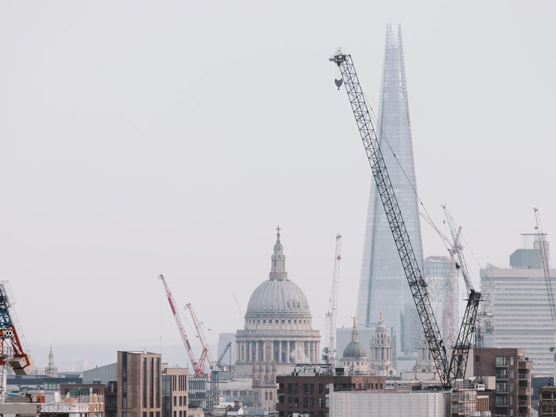 London cityscape skyline with iconic landmark buildings in The City with dramatic stormy sky