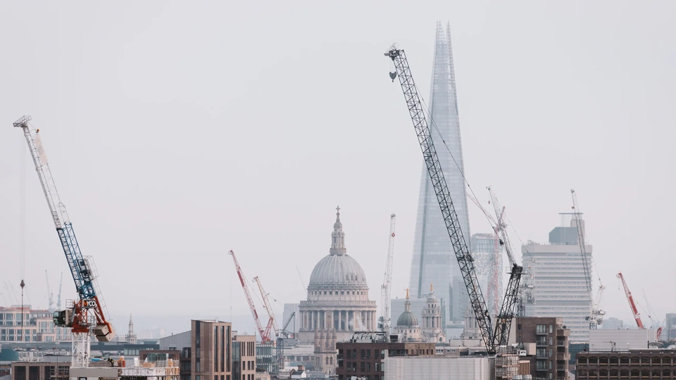 London cityscape skyline with iconic landmark buildings in The City with dramatic stormy sky
