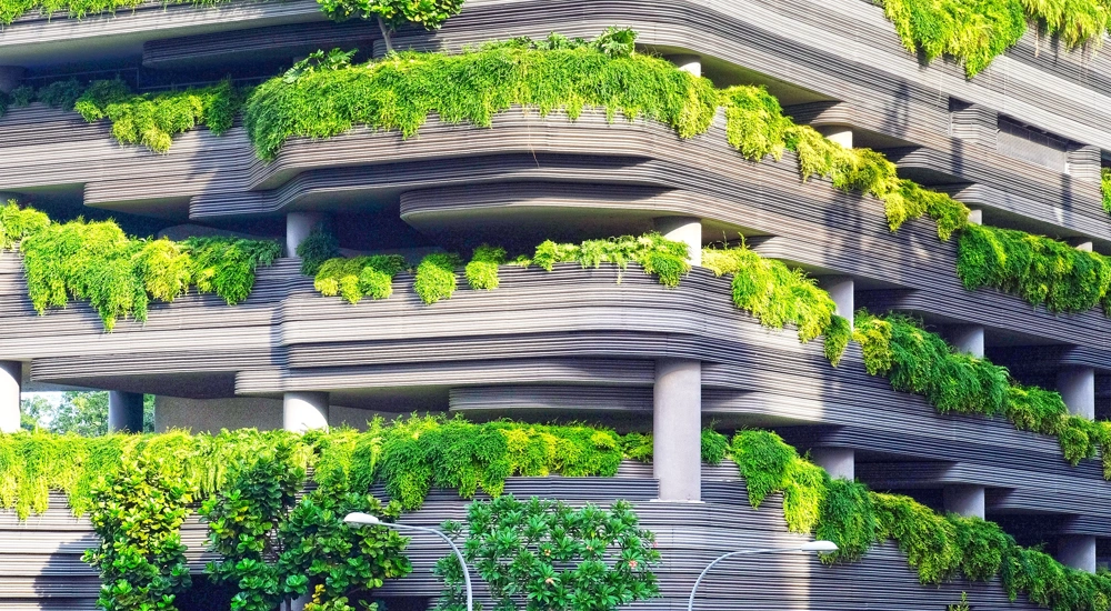 Multi storey car park with over flowing green plants