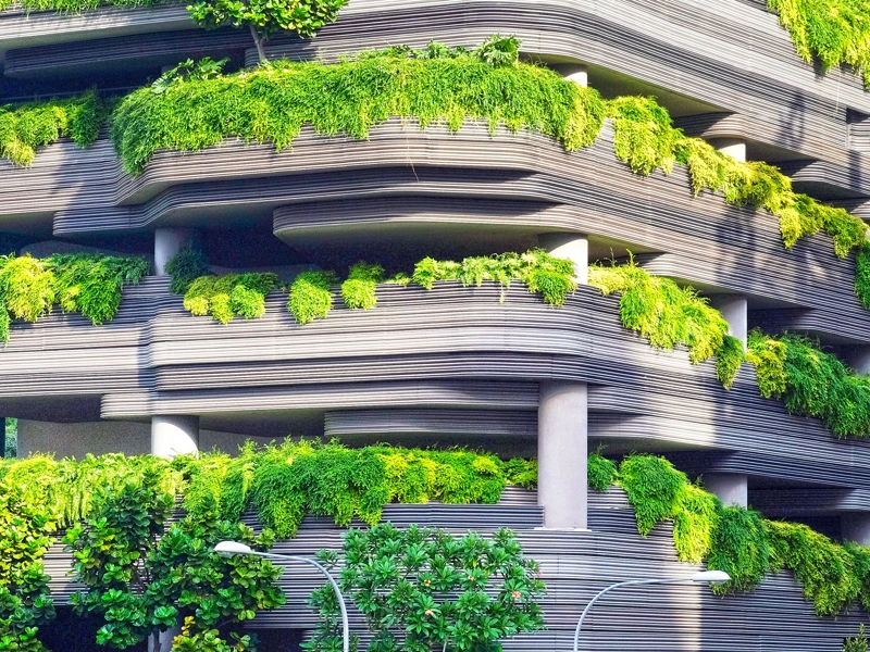 Multi storey car park with over flowing green plants