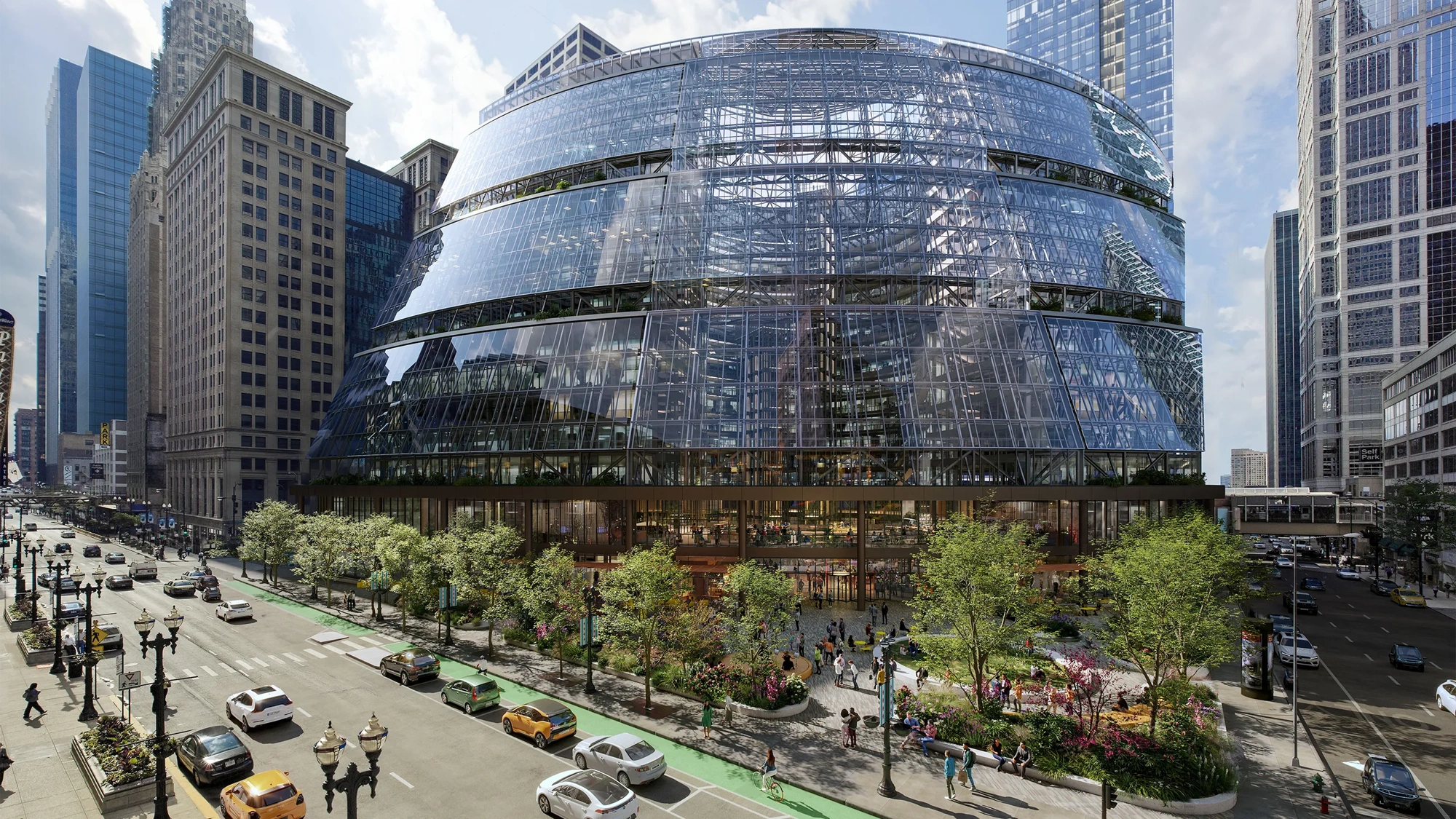 The Google Thompson Center in Chicago, a 17-storey, glass fronted building set to a backdrop of cars and greenery.