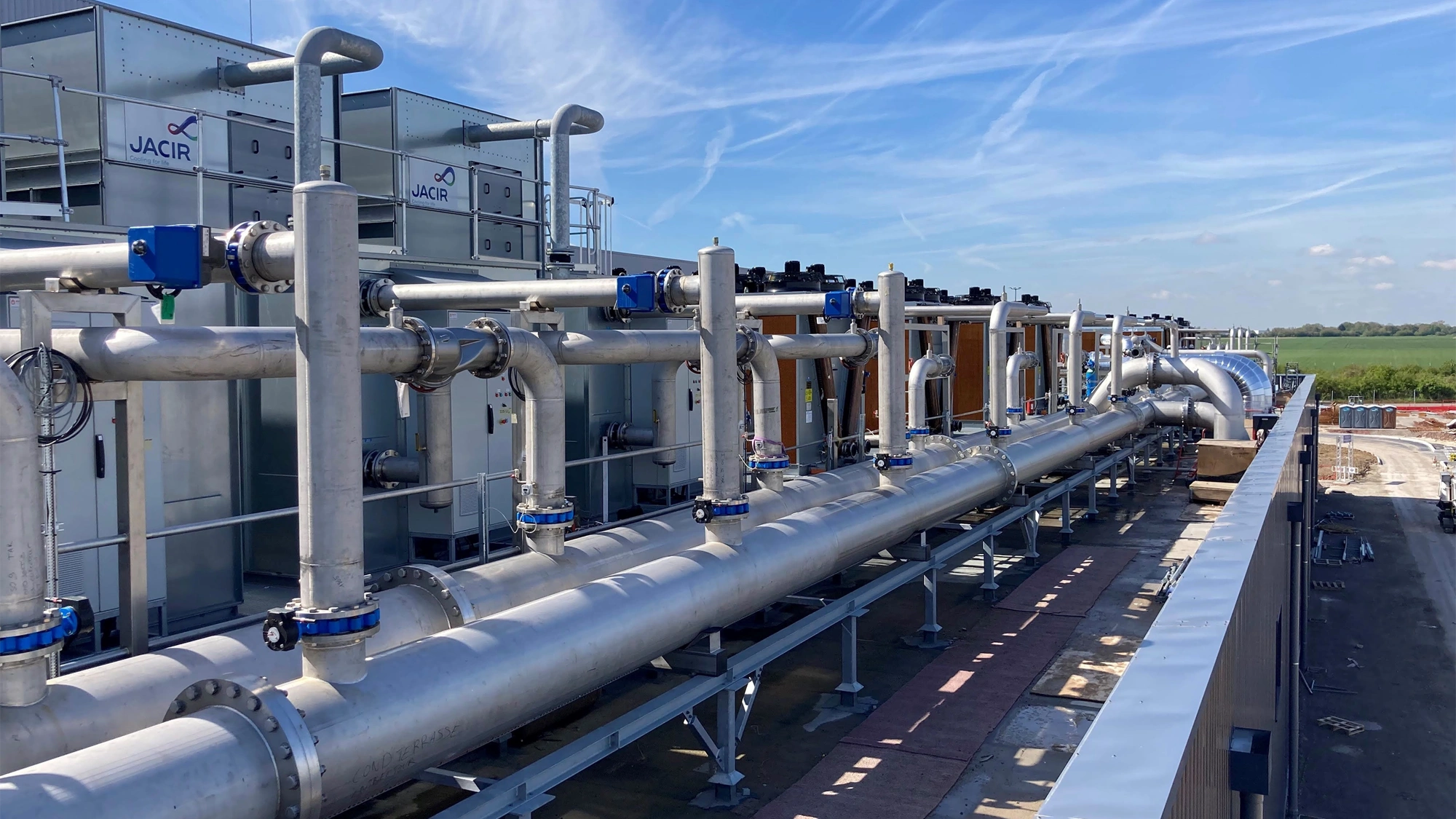 Sunny exterior shot of the AESC Douai battery gigafactory in France.