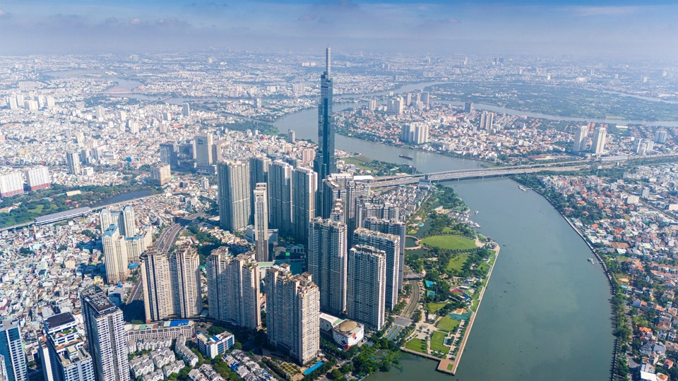 Aerial view of early morning at Landmark 81 is a super tall skyscraper in center Ho Chi Minh City, Vietnam and Saigon bridge with development buildings, energy power infrastructure