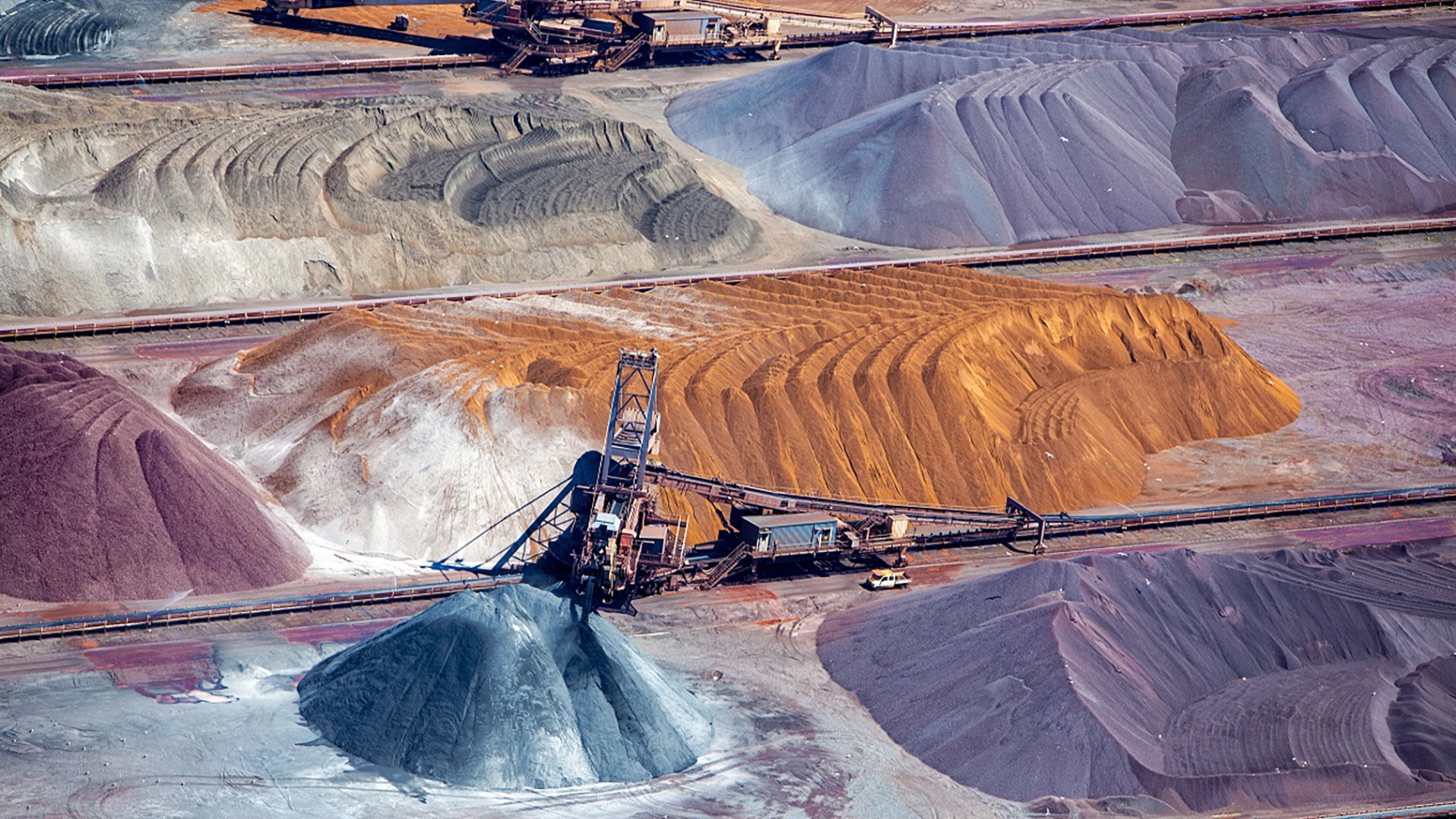 Construction site on colourful sandy mountains