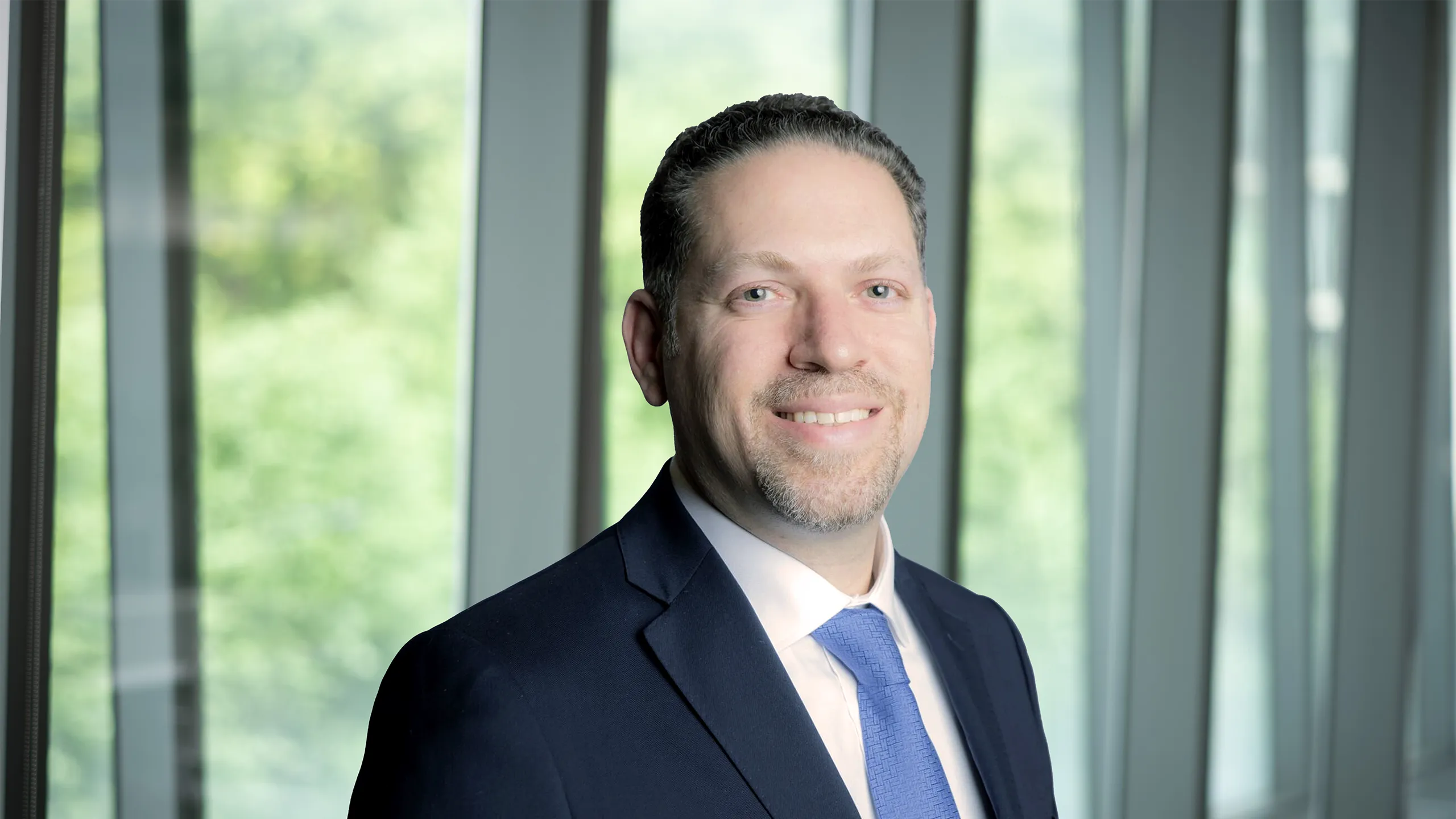 Profile picture of professional male in a suit and tie
