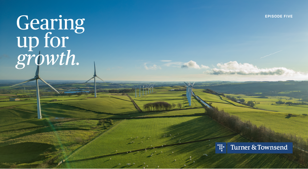 Wind turbines on a green field at daytime 