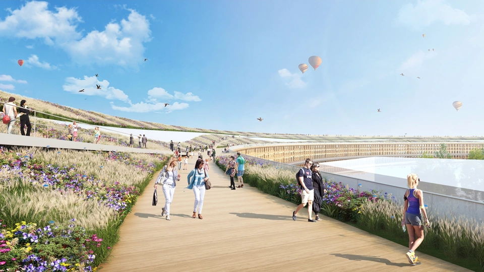 Rendered image of promenade with people walking and exercising and hot air balloons in the distance