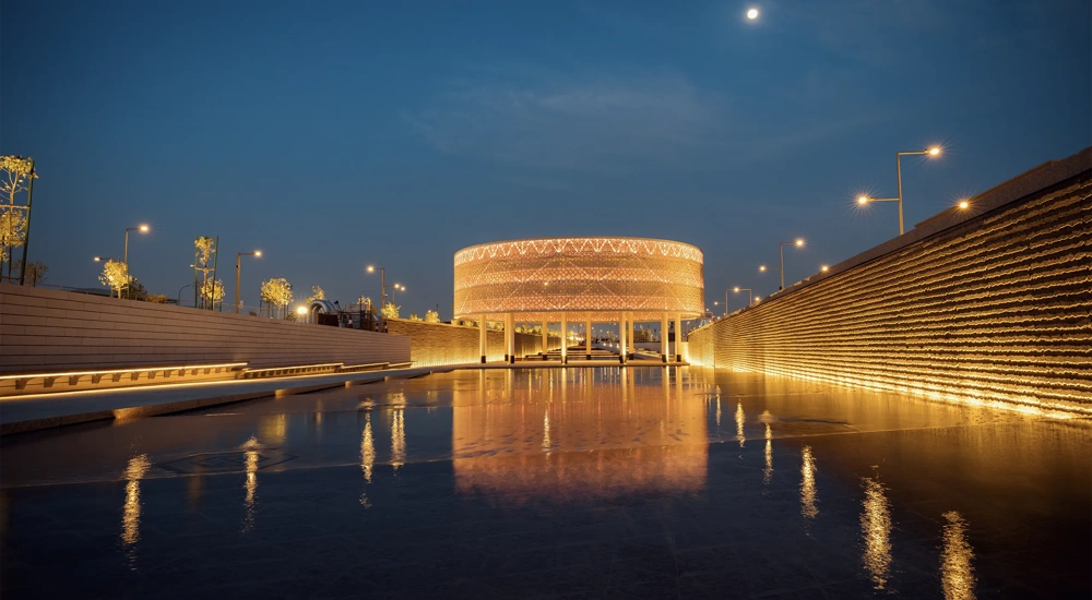 Sports Boulevard at night, illuminating golden colour with wet pathway, Kingdom of Saudi Arabia