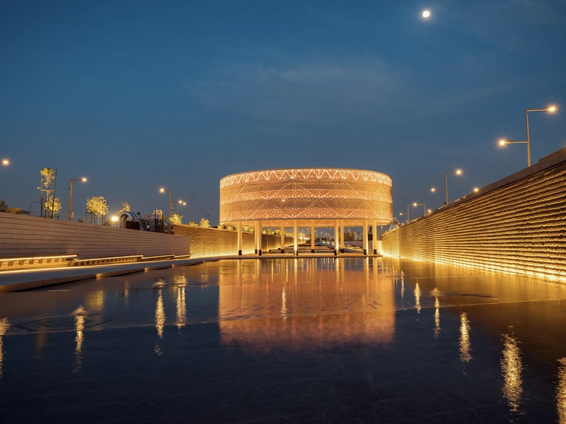 Sports Boulevard at night, illuminating golden colour with wet pathway, Kingdom of Saudi Arabia