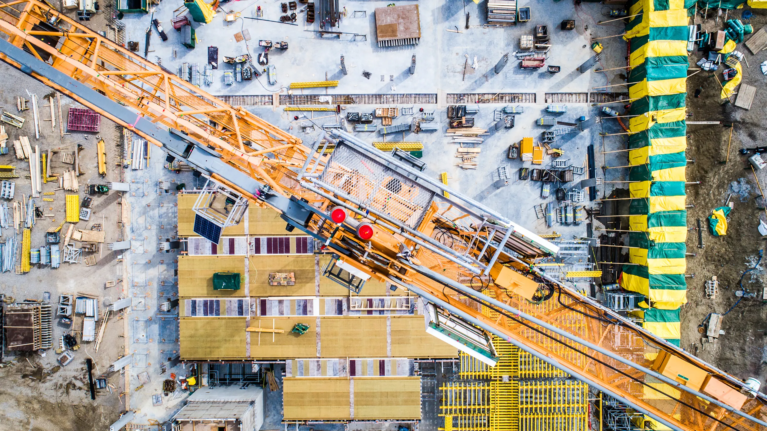 Nadir view of an industrial site, with cranes, concrete work, and more.