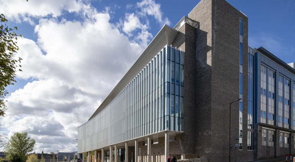 Edinburgh Institute of Genetics and Cancer building, with blue skies and cloads.