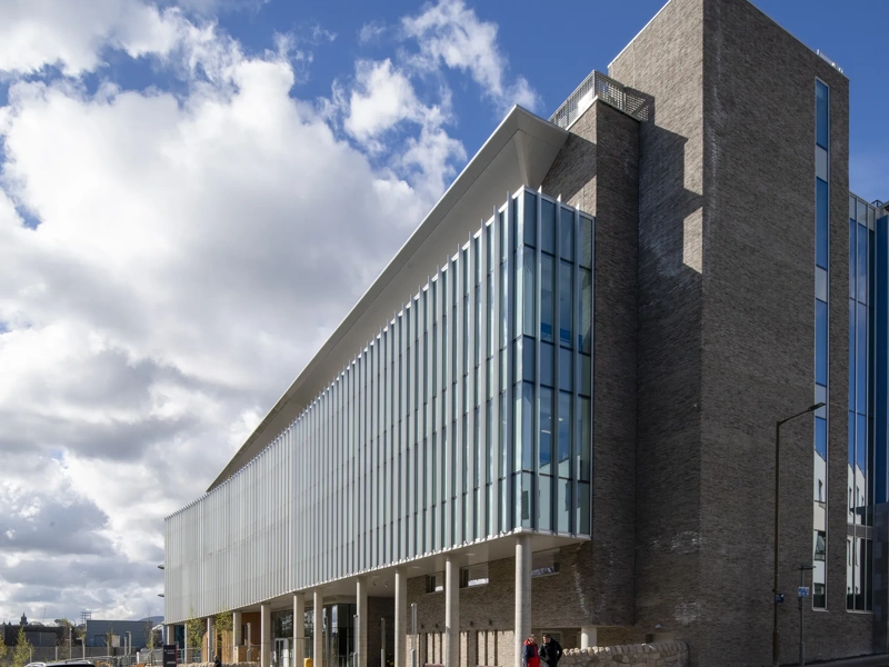 Edinburgh Institute of Genetics and Cancer building, with blue skies and cloads.