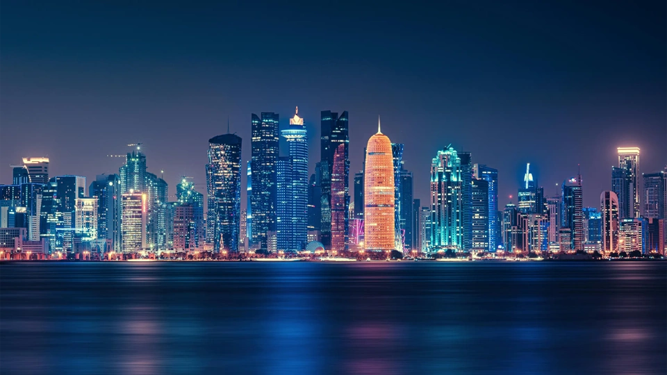 Futuristic Modern Skyline with Reflection in the Still Corniche Bay Waters, Last of the Sunlight Falling on the Buildings.