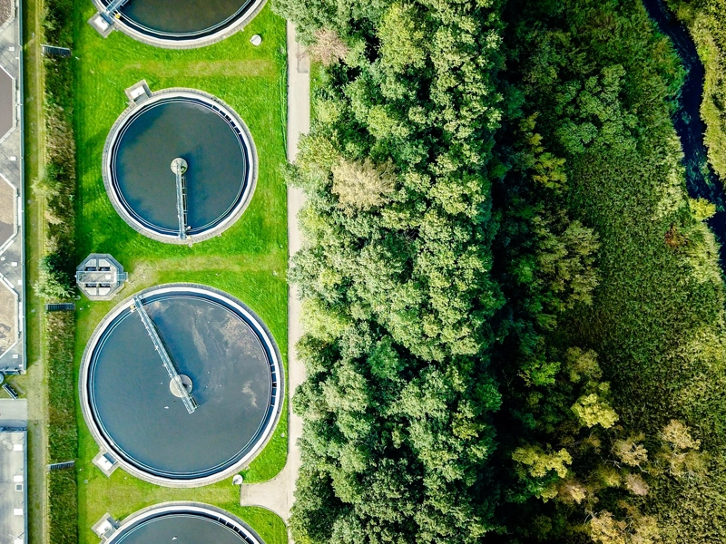 Aerial shot of water tanks in field
