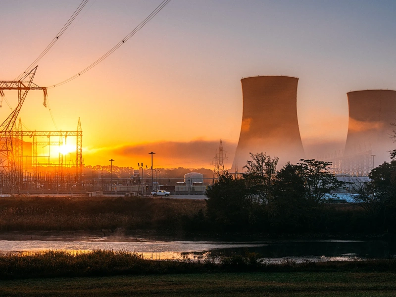 Vibrant Colored Image of two cooling towers of a nuclear power facility in Tennessee, USA on a Sunny Autumn Day. A facility like this creates jobs for the local economy, provides carbon-free electricity to the region, and reduces greenhouse gas emissions.